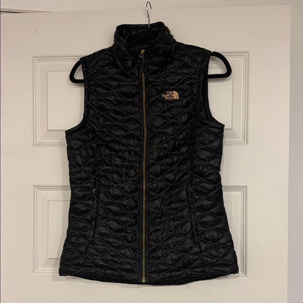 The North Face Women's Black Quilted Vest with Gold Logo